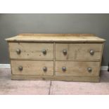 A pine sideboard with four long drawers on pediment base, 154cm wide