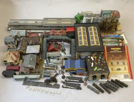 An extensive collection of 00 gauge plastic, card and cast-metal trackside buildings and