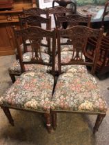 A set of six Edwardian walnut dining chairs together with a set of four walnut dining chairs of