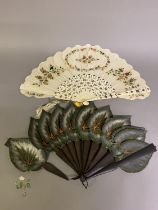 Two 19th century Jenny Lind or Palmette fans, the first an attractive example in cream silk, the