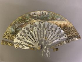 A mid-19th century mother of pearl fan, the monture shaped, carved and gilded, the narrow,