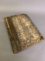 An unusual scrapbook of costume and accessories, leather bound, compiling gravures and later hand-