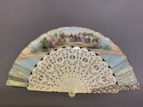 A good bone mid-19th century fan, the monture silvered, the colourful lithographed leaf, of narrow