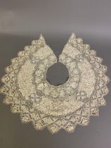 Antique lace: a deep silk Maltese collar, the design incorporating the Maltese Cross, worked in 3