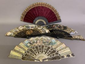 The Mid-19th century: a lithographed fan leaf mounted on wide wood sticks, painted black and gilded,