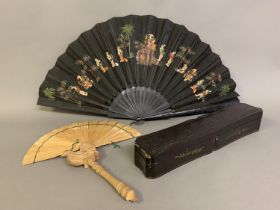 A highly decorative 19th century wooden brisé fan, likely from Indonesia, or Malaysia, crafted