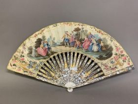 A fine 18th century mother of pearl fan, gilded, both guards with classical designs and a large