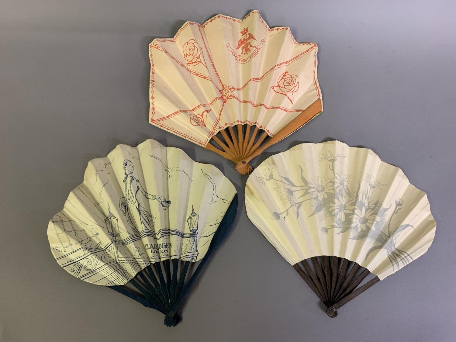 A very Deco ballon fan, unusually with straight sides, showing an elegant lady choosing her - Image 2 of 2
