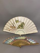 Two 19th century fans with quite wistful, dreamlike themes, the first with painted silk leaf, the