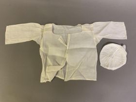 Hollie Point: A fine linen chemise or shirt for a baby, in a generous size, the shoulders inserted