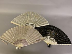 Three attractive late 19th century fans, c 1890’s, the first in bone with serpentine sticks, a black