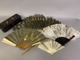 A female ostrich feather fan, medium size, mounted on tortoiseshell sticks, height approx. 36 cm;