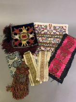 Africa, Asia, and Eastern Europe: A selection of embroidered and woven items to include a band of