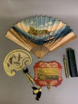 Topographical and other fans: A 19th century hand screen of papier maché painted red with gold