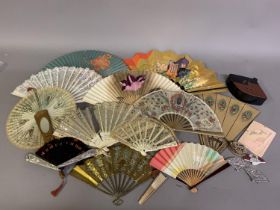 An eclectic selection of fan related items: a leather folder marked Papeterie, fan shaped. With