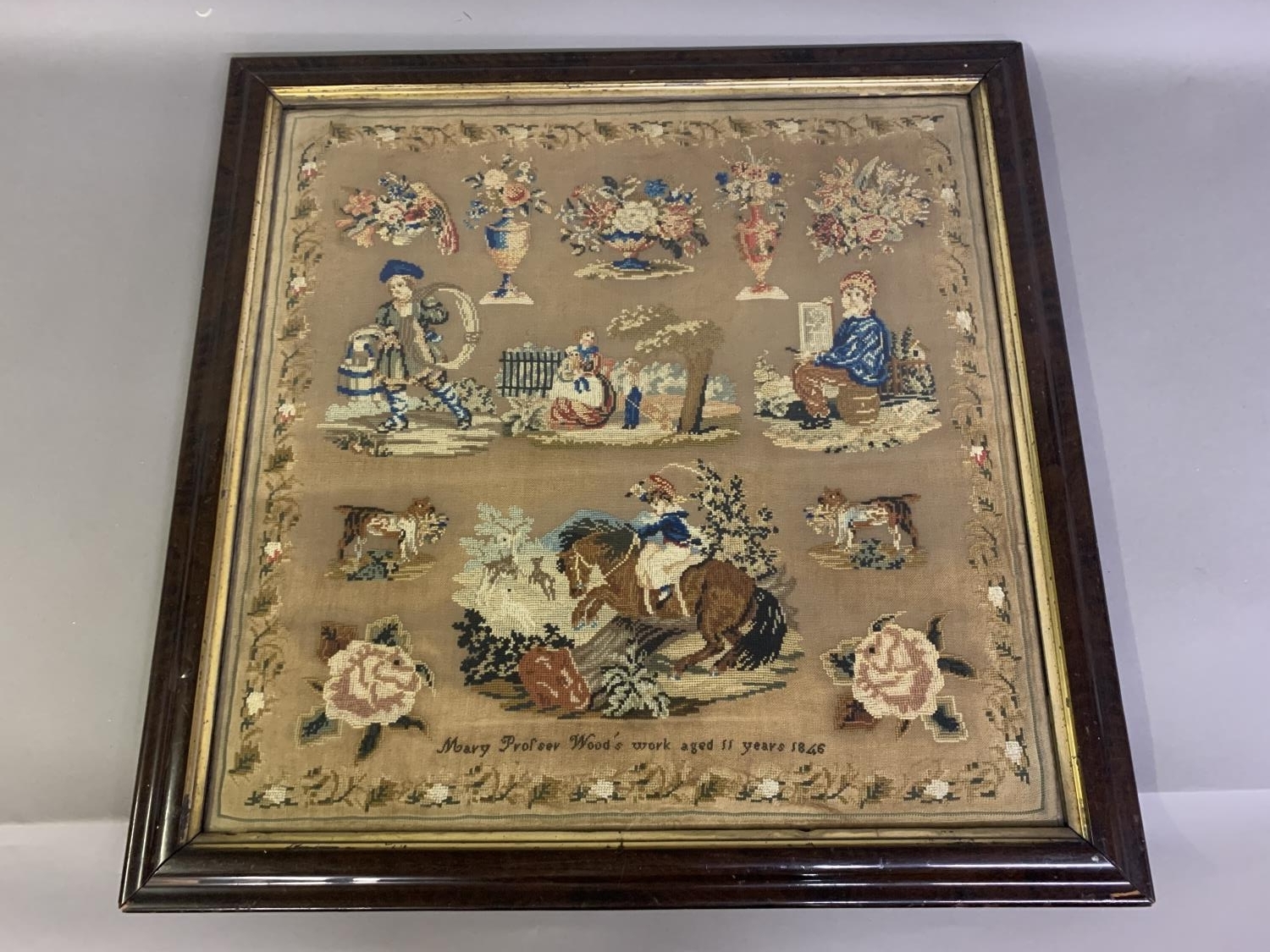 A large 19th century framed and glazed wool and silk work picture dated 1846 “Mary Profser’s work