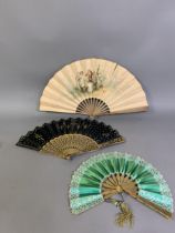 Three 19th century fans: a telescopic fan with wood sticks painted in gold, the emerald green silk