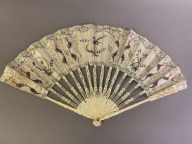 An mid- 18th century bone fan, the monture pierced and shaped, the upper guards wider with deeper