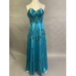A vintage full-length strapless sea-green satin evening gown with boned bodice, embroidered in a