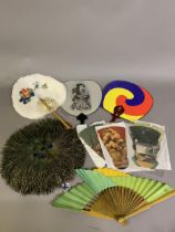 An assortment of 19th and 20th century fans and fixed fans, to include feather and folding: a