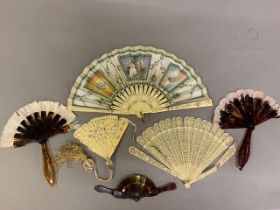 An elegant bone fan, the monture lightly gilded with the addition of pastel flowers, the central