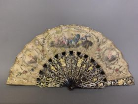 A fine 18th century tortoiseshell fan, Franch, the very ornate monture shaped and gilded, the guards