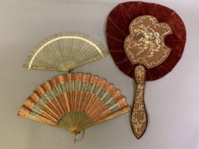 Two fans and a fabric face screen: A small circa 1820’ pale horn brisé fan, carved and pierced, with
