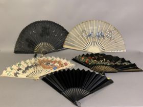 Five large, late 19th century fans, the first painted on silk with scenes of Burmese celebrations