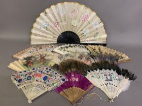 A quantity of Chinese fans, to include three of painted goose feather, mounted on bone, two with