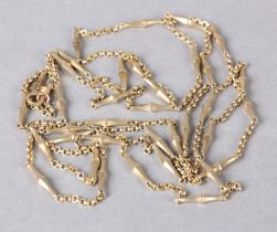 AN EARLY 20TH CENTURY LORGNETTES CHAIN in 14ct gold trace and and baluster fetter links with