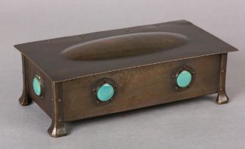 AN ARTS AND CRAFTS BRONZE BOX lightly planished having a semi domed lid, collette set with turquoise