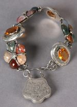 A VICTORIAN SCOTTISH PEBBLE BRACELET in silver, alternate links set with oval facetted paste and