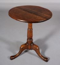 A 19TH CENTURY OAK TRIPOD TABLE, circular, on a turned column and cabriole legs, 50cm diameter
