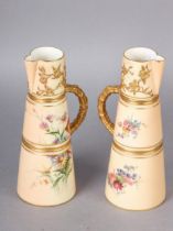 A MATCHED PAIR OF ROYAL WORCESTER EWERS, polychrome painted with butterfly and wildflowers against a