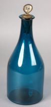 A 19TH CENTURY TURQUOISE GLASS DECANTER with smoothed pontil, mother-of-pearl stopper lettered