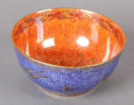 A WEDGWOOD LUSTRE BOWL DESIGNED BY DAISY MAKEIG-JONES, the blue mottled exterior printed in gilt