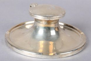 A GEORGE V SILVER 'CAPSTAN' INKWELL, of typical form, Sheffield 1934, maker's mark for Walker and
