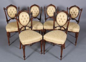 A SET OF SIX VICTORIAN WALNUT DINING CHAIRS, having a moulded frame with foliate paterae, oval