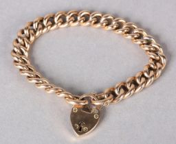 A GEORGE V CURB LINK BRACELET in 9ct rose gold with padlock fastener, initialled A, approximate