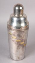 A MID 20TH CENTURY SILVER PLATED COCKTAIL SHAKER, with patent twist double sleeve body, the gilded