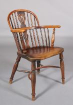 A LATE 18TH CENTURY YEW-WOOD LOW BACK WINDSOR ARMCHAIR, having a pierced splat and rail back, elm