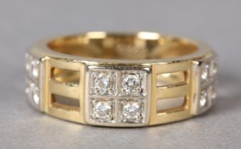 A DIAMOND DRESS RING in 18ct gold, the brilliant cut stones grain set within three square clusters