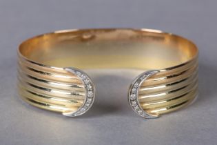 A DIAMOND BANGLE in yellow, white and rose 18ct gold, each D terminal set with a crescent of