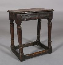 A MID 17TH CENTURY OAK JOINT STOOL, the seat with moulded edge over an apron carved with gouge-cut