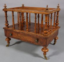 A VICTORIAN FIGURED WALNUT CANTERBURY, having three divisions with turned spindles and finials,