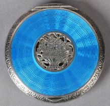 A SILVER ENAMEL COMPACT c1930, of circular outline, the engraved and pierced jardiniere central