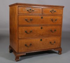 A MID 19TH CENTURY OAK CHEST of two short and three long graduated drawers, cock beaded with brass