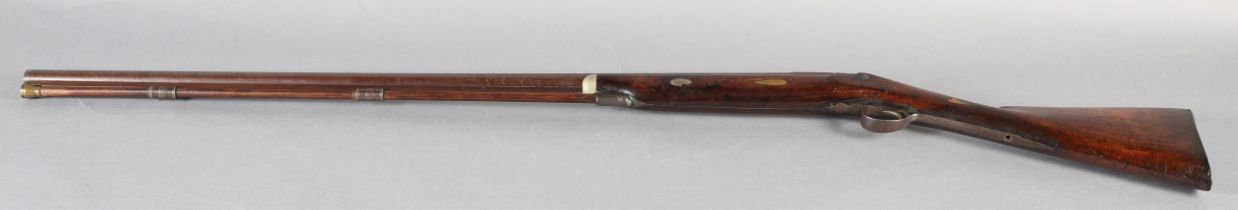 A LATE 18TH/EARLY 19TH CENTURY SEVEN BORE FOWLING PIECE converted from flint to percussion shot gun,