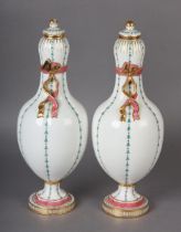 A PAIR OF LATE 19TH CENTURY CONTINENTAL WHITE PORCELAIN VASES AND COVERS, of lobed baluster form,