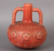 A BURMANTOFTS FAIENCE TWIN HANDLED VASE of globular form, having twin ribbed handles to the